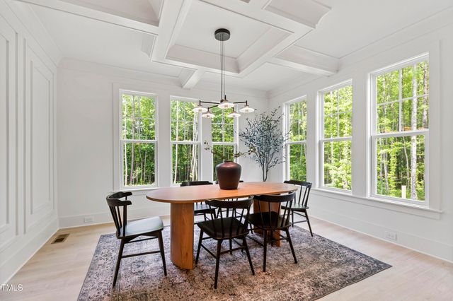 a spacious bedroom with a bed a couch and a window