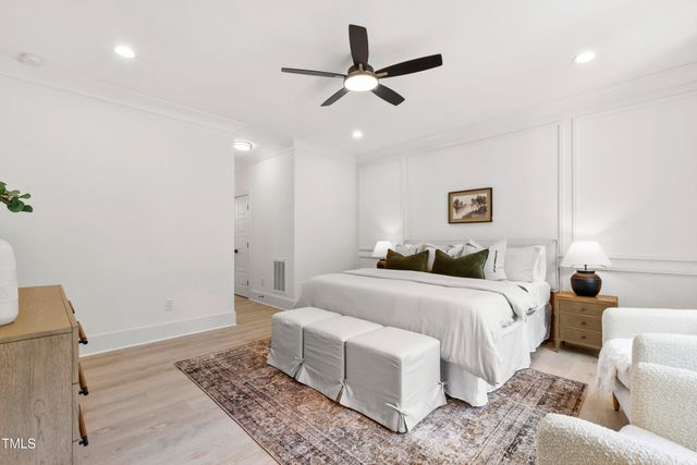 a large bathroom with a double vanity sink and mirror with shower