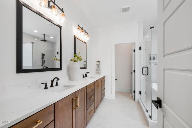 a white bath tub sitting next to a white sink