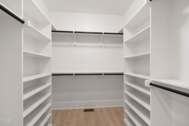 a view of a hallway with windows