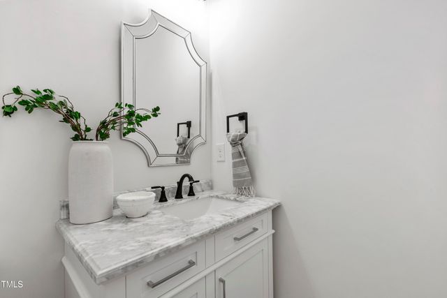 a view of a room with a ceiling fan