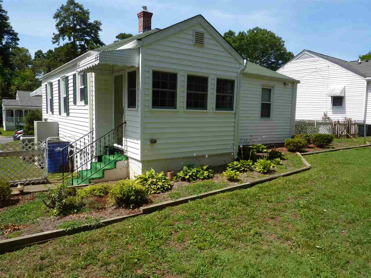 Lovely garden areas around the home's exterior. Exterior Back