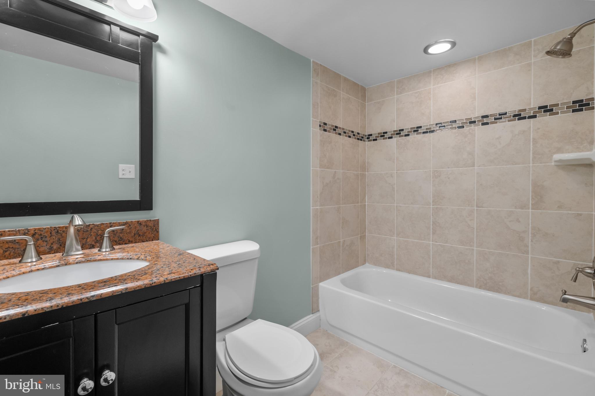 3916 5th Street Northwest Washington, DC 20011 - Photo 35 of 51 a bathroom with a sink a toilet and a bathtub