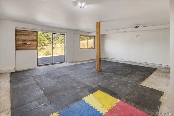 a view of a terrace with a bench in the middle