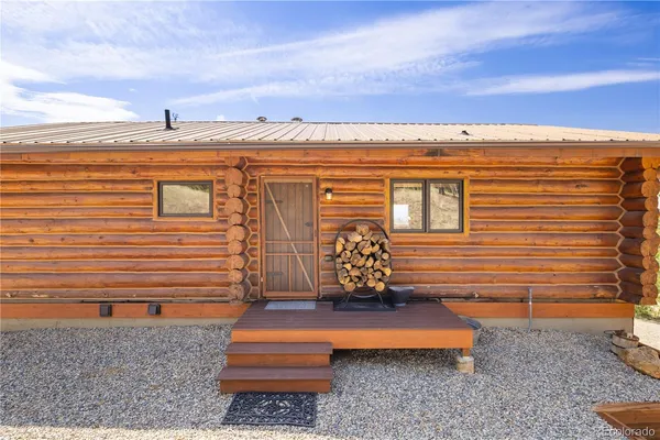 a view of two chairs in the balcony