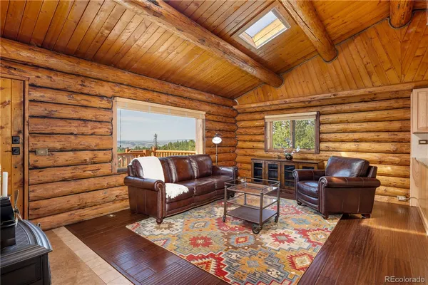 a living room with furniture and a rug