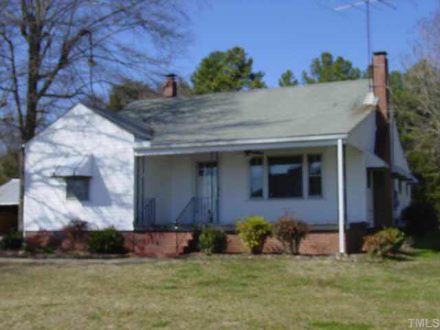1813 Bahama Road Bahama, NC 27503 - Photo 1 of 3 a front view of a house with a yard