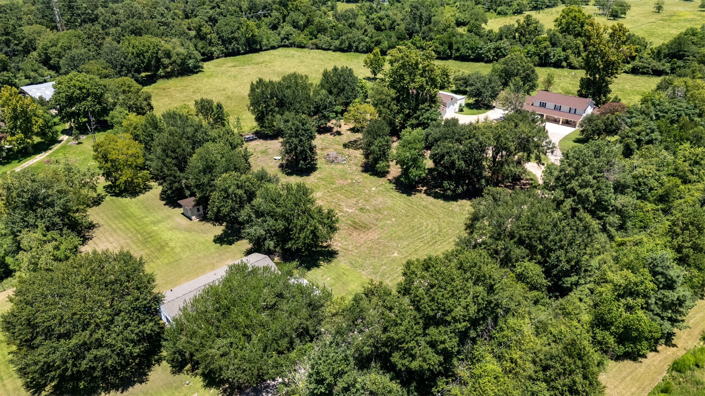 1533 South Cherry Street Tomball, TX 77375 - Photo 4 of 10 an aerial view of residential house with swimming pool and green space