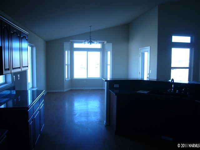 1880 Heidi Road Fallon, NV 89406 - Photo 11 of 13 a view of an empty room with window and wooden floor