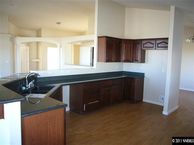 1880 Heidi Road Fallon, NV 89406 - Photo 10 of 13 a kitchen with a sink a stove and cabinets