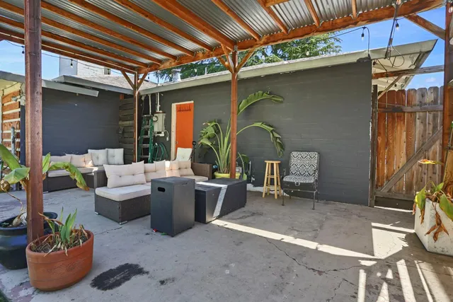 a view of a swimming pool with a chair and tables