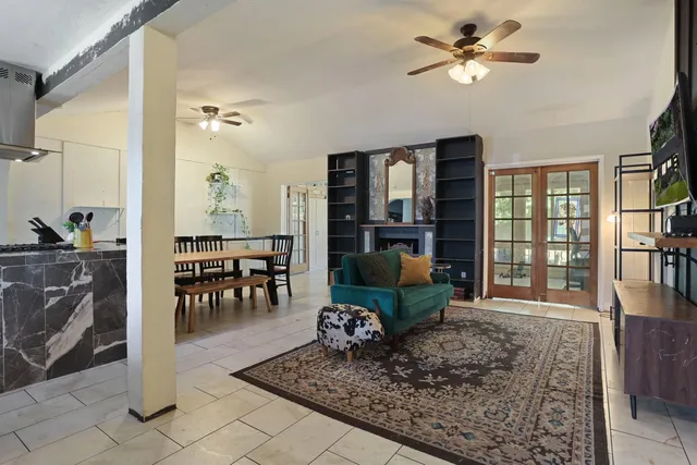 a living room with furniture rug and window