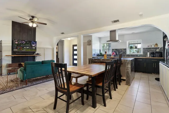 a kitchen with a table and chairs in it