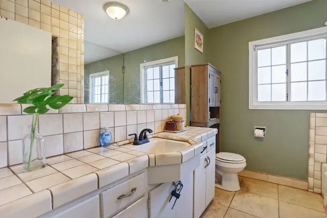 a bed room with a bed and a fish tank