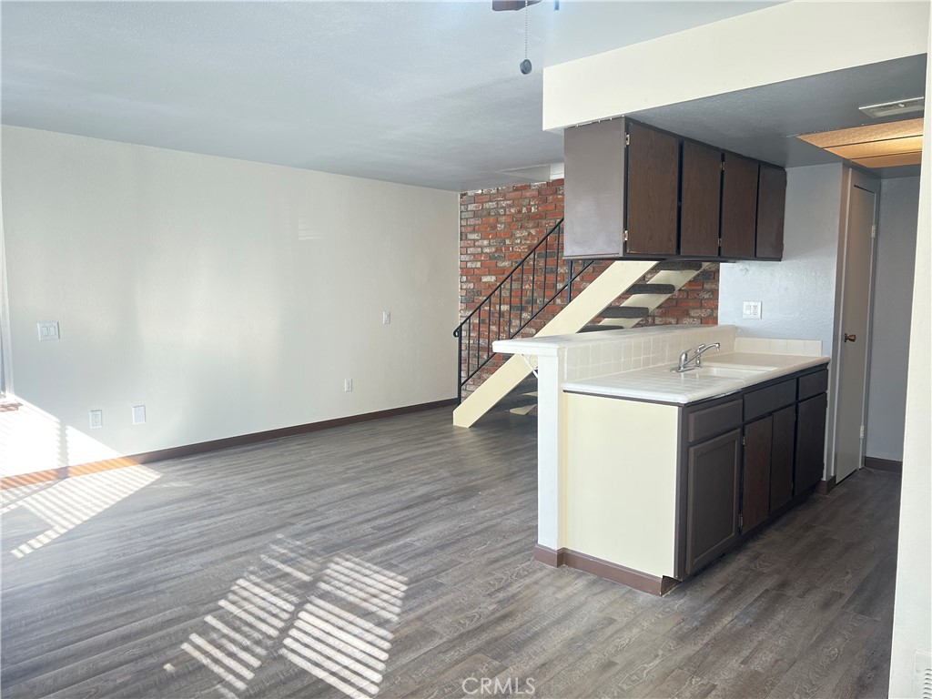 3535 20th Street Highland, CA 92346 - Photo 4 of 14 a utility room with wooden floor washer and dryer