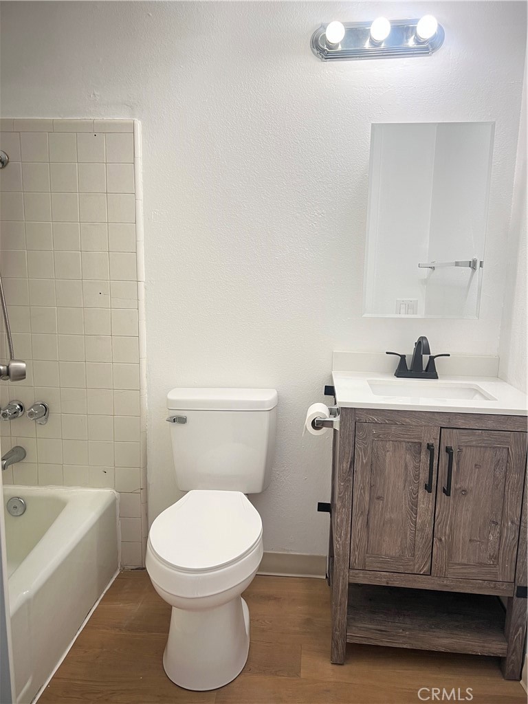 3535 20th Street Highland, CA 92346 - Photo 9 of 14 a bathroom with a sink a toilet and bathtub