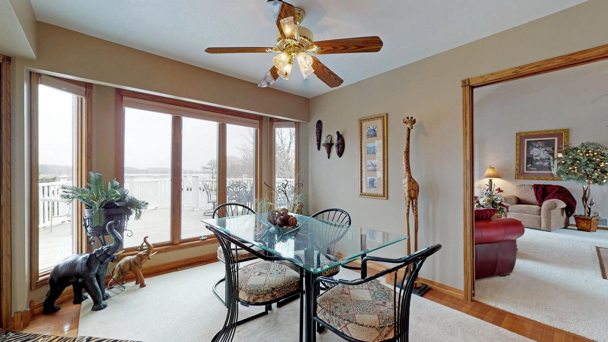 532 Baintree Road Lake Summerset, IL 61019 - Photo 8 of 25 a living room with furniture and floor to ceiling windows