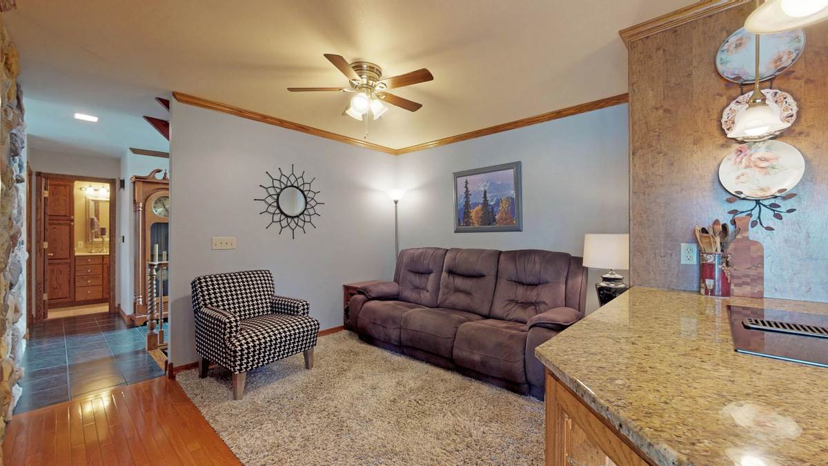 532 Baintree Road Lake Summerset, IL 61019 - Photo 10 of 25 a living room with furniture and a chandelier