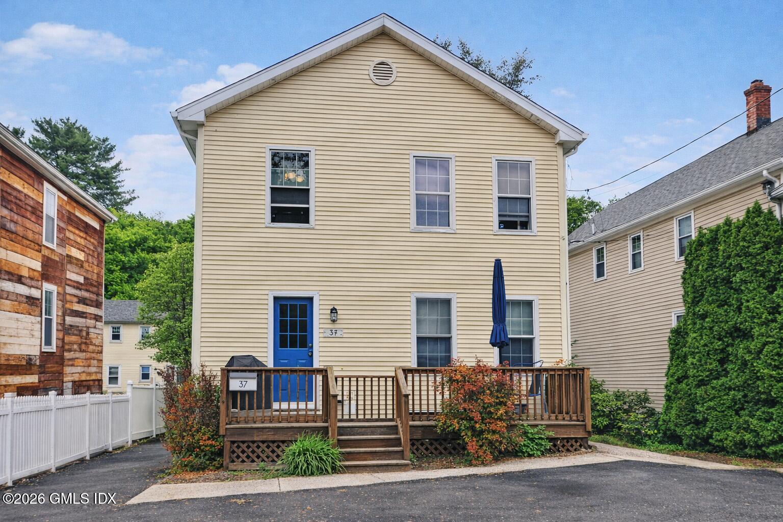 37 Prospect Street Greenwich, CT 06830 - Photo 1 of 41 a front view of a house with garage