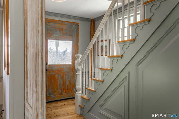 a view of front door with stairs