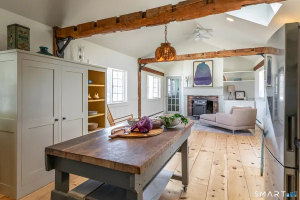 a view of a livingroom with furniture and a fireplace