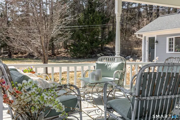 a view of balcony with furniture