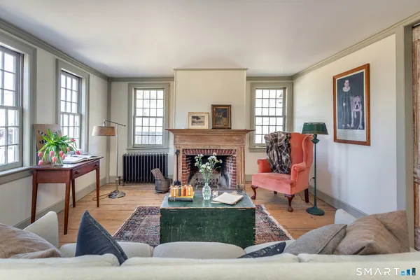 a living room with furniture and a fireplace