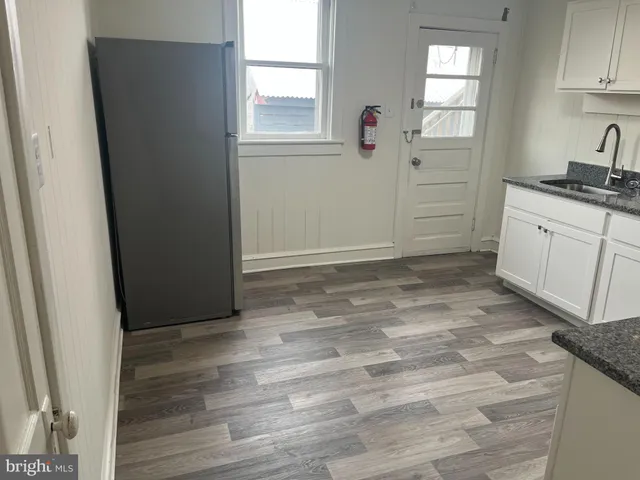 en empty room with window and cabinet