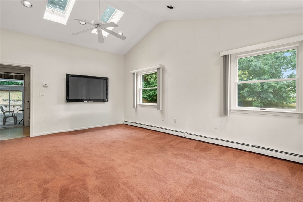 6 Paulette Drive Danvers, MA 01923 - Photo 29 of 35 a view of an empty room with a window and a flat screen tv