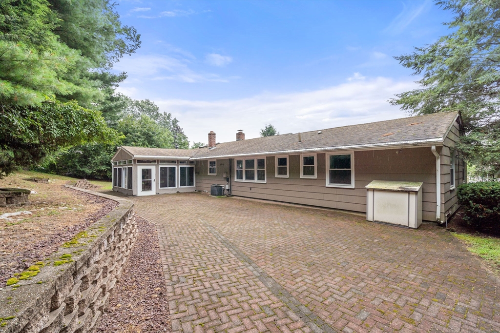 6 Paulette Drive Danvers, MA 01923 - Photo 5 of 35 a front view of a house with garden