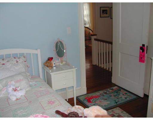 885 Webster Street Needham, MA 02492 - Photo 17 of 27 a bedroom with a bed and cabinets