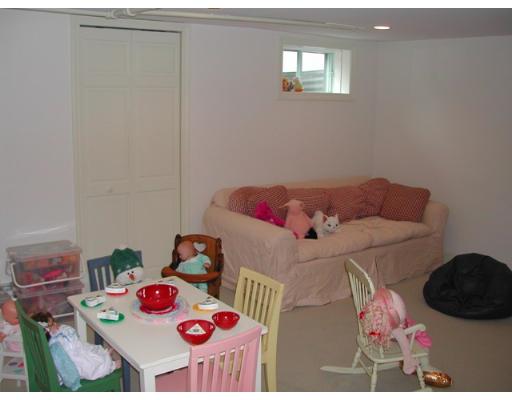 885 Webster Street Needham, MA 02492 - Photo 23 of 27 a bedroom with a bed and a dresser