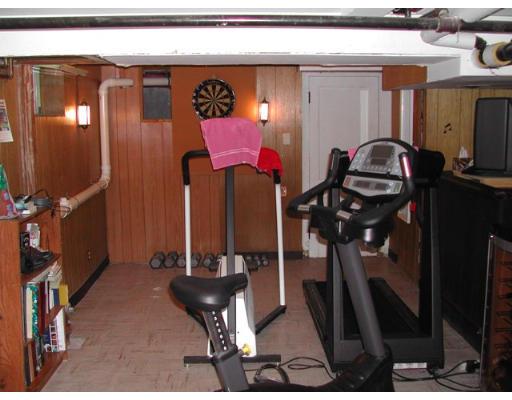 885 Webster Street Needham, MA 02492 - Photo 25 of 27 a room with lots of chairs and mirrors