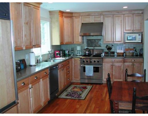 885 Webster Street Needham, MA 02492 - Photo 5 of 27 a kitchen with stainless steel appliances granite countertop a stove a sink dishwasher and cabinets with wooden floor