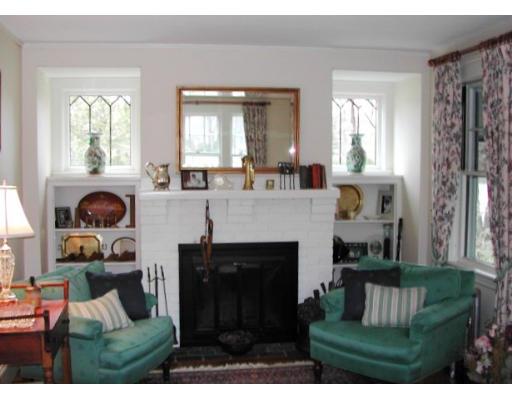 885 Webster Street Needham, MA 02492 - Photo 8 of 27 a living room with furniture and a fireplace
