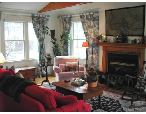 885 Webster Street Needham, MA 02492 - Photo 10 of 27 a living room with furniture and a fireplace