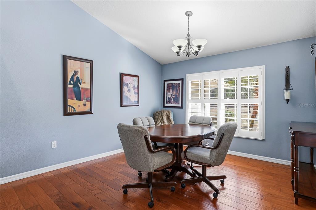 296 North Quartz Avenue Hernando, FL 34442 - Photo 11 of 66 a view of a dining room with furniture window and wooden floor