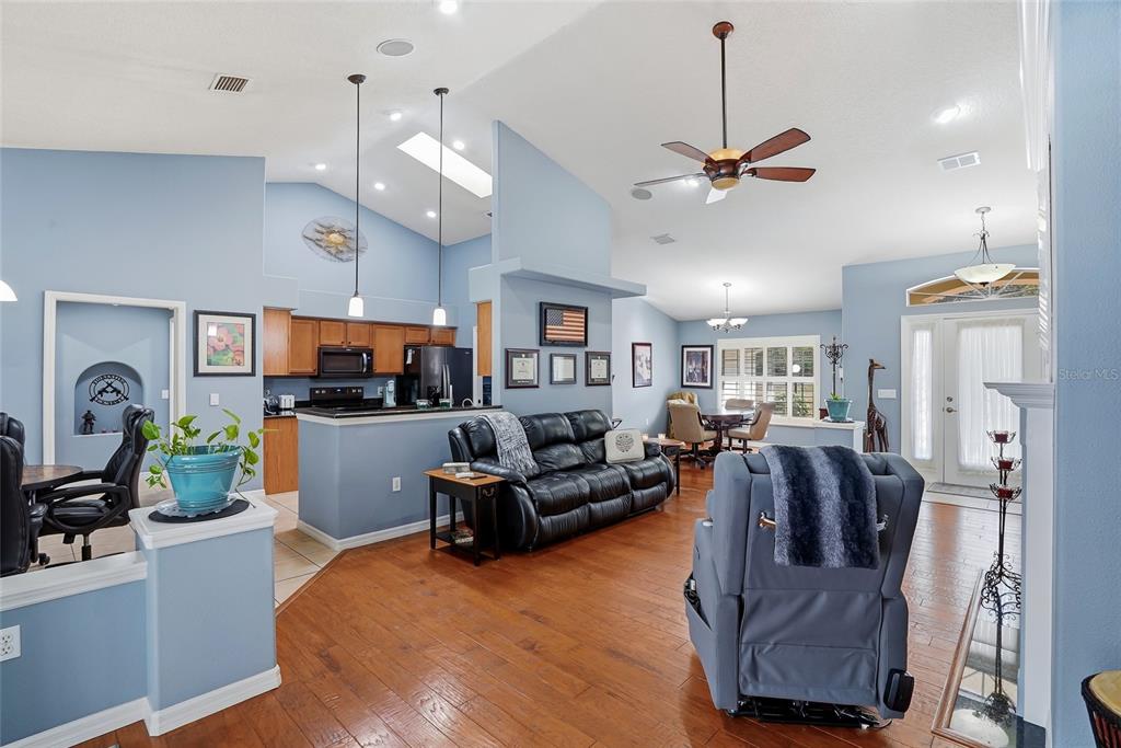 296 North Quartz Avenue Hernando, FL 34442 - Photo 14 of 66 a living room with furniture kitchen view and a chandelier