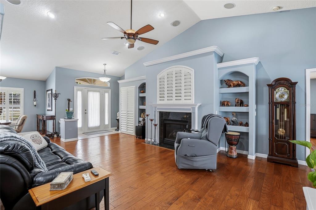 296 North Quartz Avenue Hernando, FL 34442 - Photo 15 of 66 a living room with furniture and a fireplace