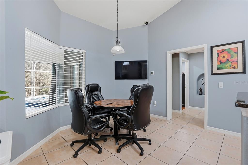 296 North Quartz Avenue Hernando, FL 34442 - Photo 17 of 66 a view of a workspace with furniture and a window