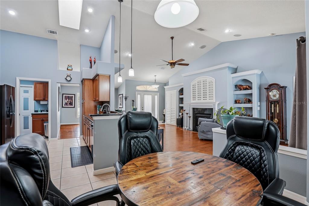 296 North Quartz Avenue Hernando, FL 34442 - Photo 18 of 66 a living room with furniture a flat screen tv and a fireplace