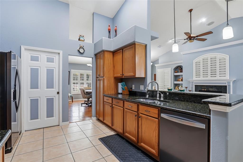 296 North Quartz Avenue Hernando, FL 34442 - Photo 21 of 66 a kitchen with stainless steel appliances a sink stove and refrigerator