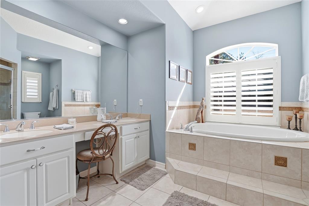 296 North Quartz Avenue Hernando, FL 34442 - Photo 29 of 66 a spacious bathroom with a double vanity sink mirror and bathtub