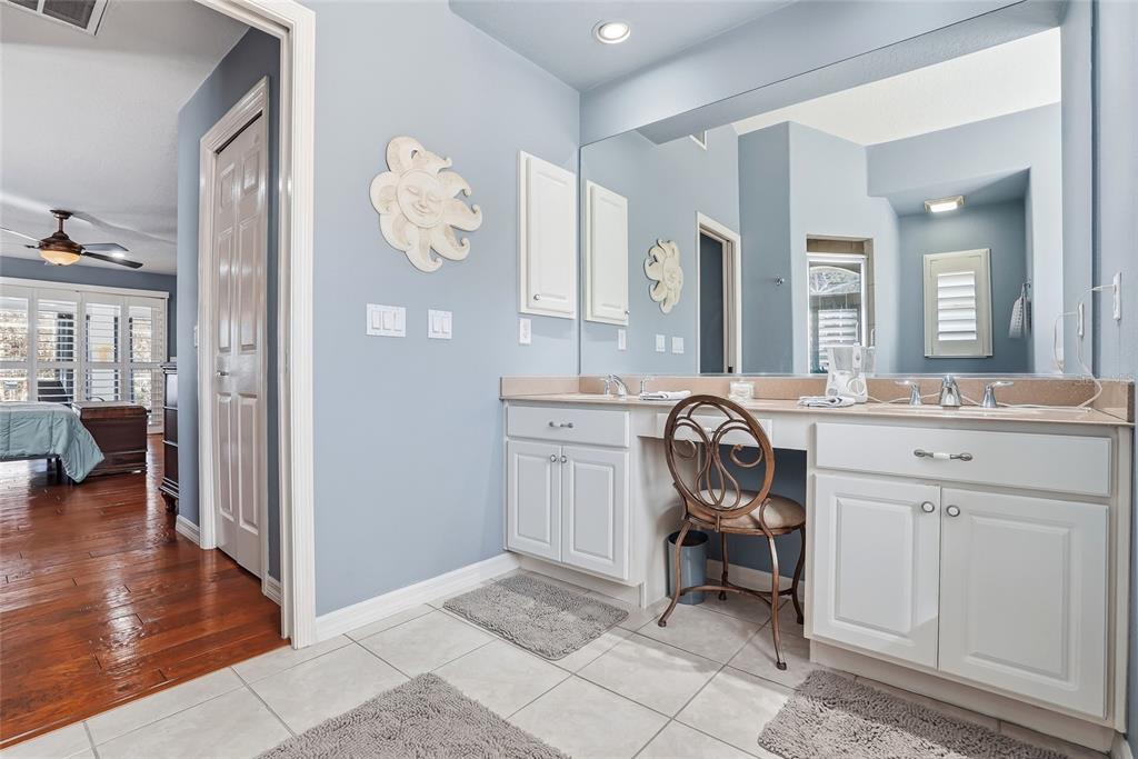 296 North Quartz Avenue Hernando, FL 34442 - Photo 31 of 66 a en suite bathroom with a sink and a mirror