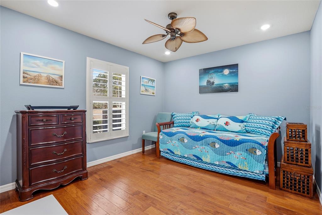 296 North Quartz Avenue Hernando, FL 34442 - Photo 32 of 66 a bedroom with a bed and a chandelier