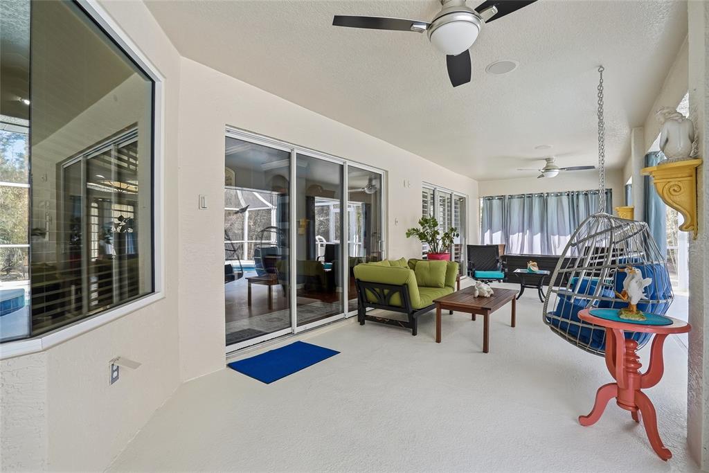 296 North Quartz Avenue Hernando, FL 34442 - Photo 38 of 66 a living room with patio furniture and a window