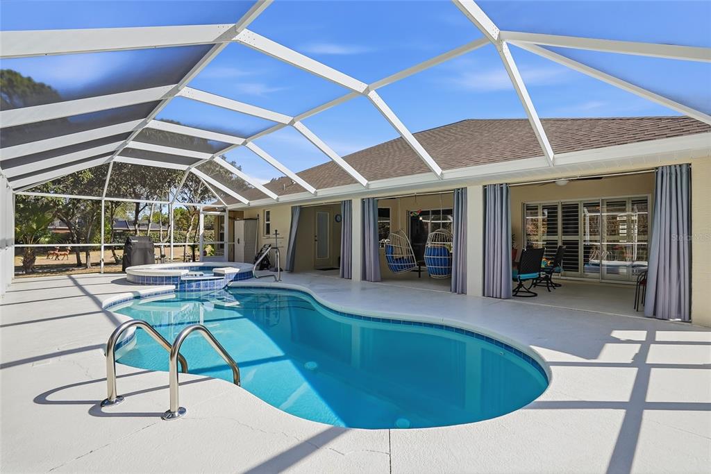 296 North Quartz Avenue Hernando, FL 34442 - Photo 5 of 66 a view of a backyard with swimming pool and sitting area