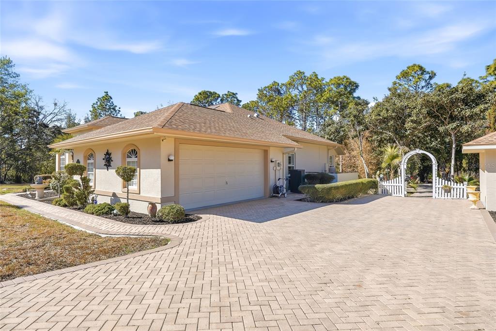 296 North Quartz Avenue Hernando, FL 34442 - Photo 51 of 66 a front view of a house with a yard and garage