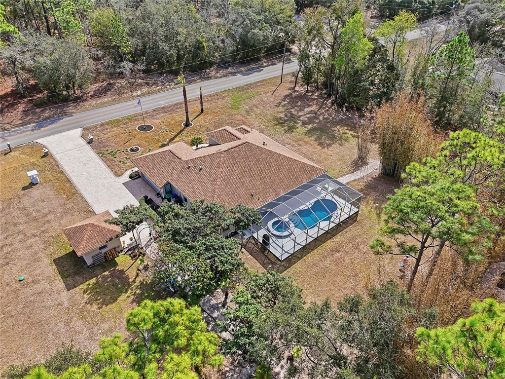 296 North Quartz Avenue Hernando, FL 34442 - Photo 66 of 66 an aerial view of a house with yard and swimming pool