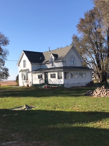 24562 Esmond Road Malta, IL 60150 - Photo 2 of 29 a front view of a house with a garden